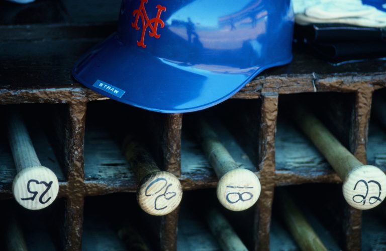 Mets Bats and Helmet in Dugout