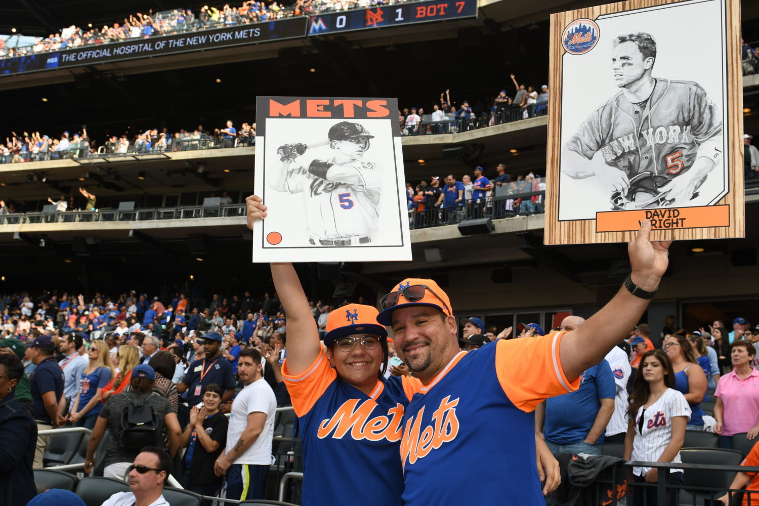 Fans Hold Up Signs Featuring David Wright During His Final Game
