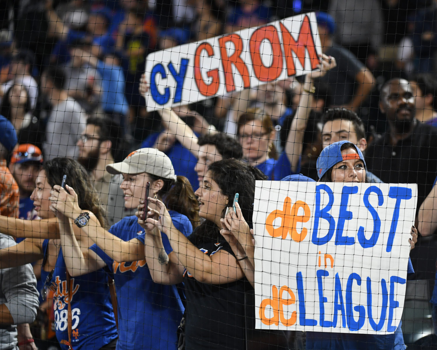 Fans Hold Up Signs for Jacob deGrom during Game on September 26, 2018