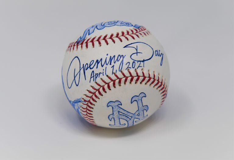 The back of a baseball with the words 