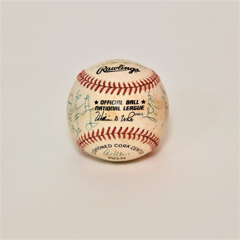 Front of baseball with scuff marks, signatures and text that reads, 