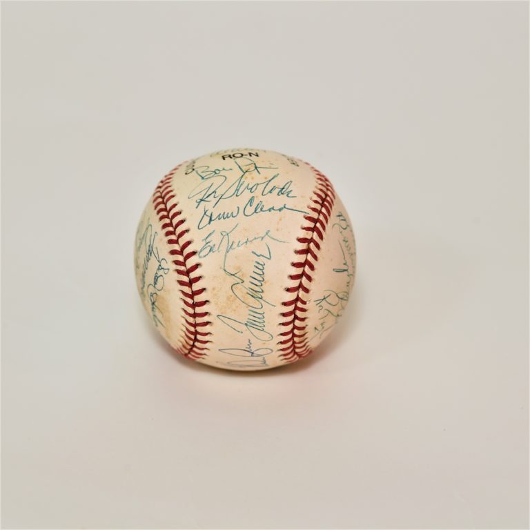 Baseball with scuff marks and signatures