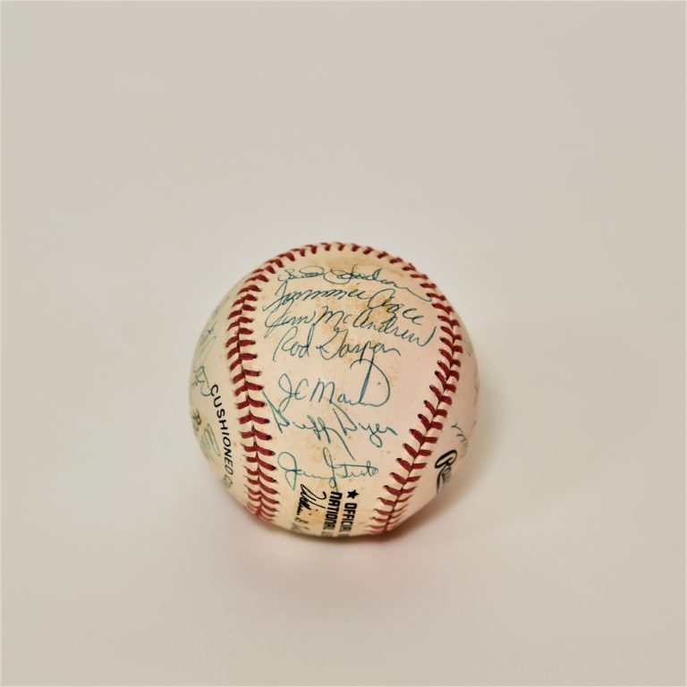 Baseball with scuff marks and signatures